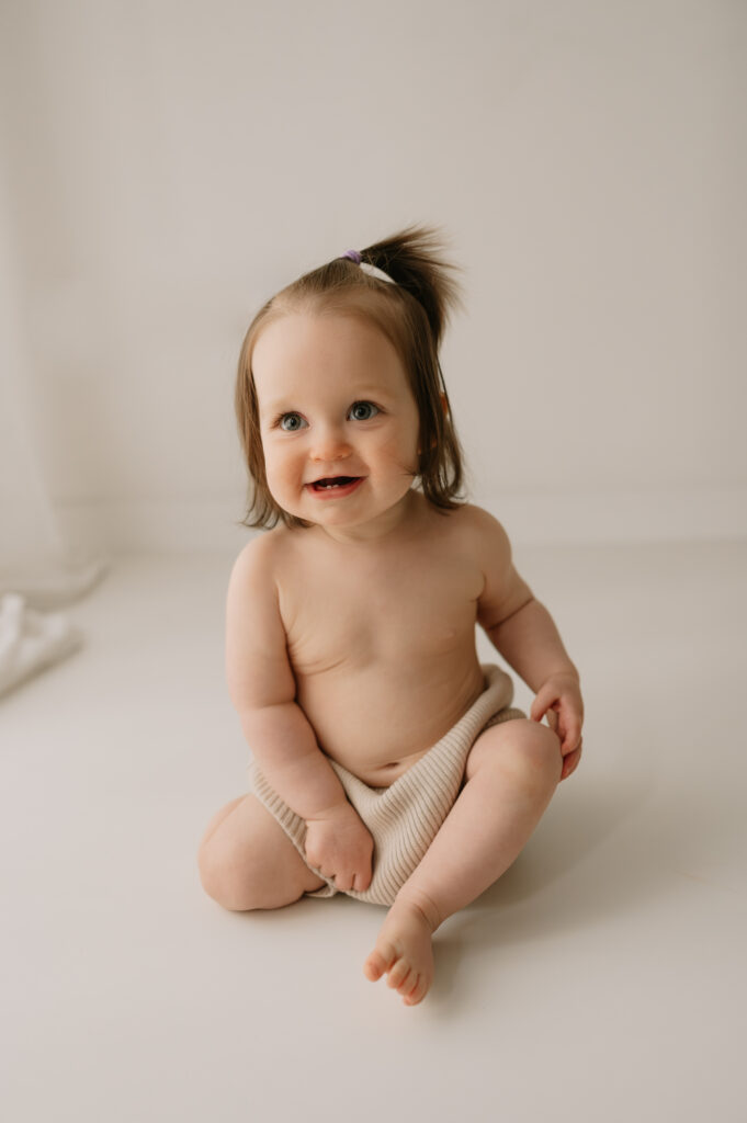 baby girl sitting up at york photography studio in central york