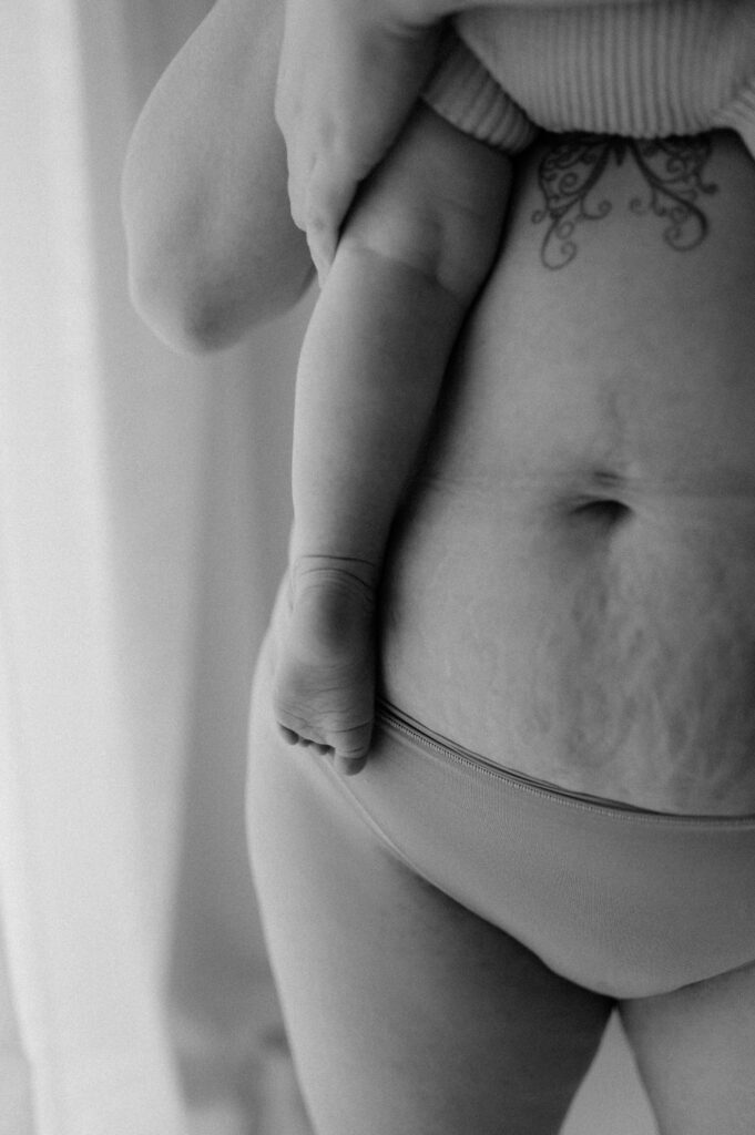 mums tummy and her babys leg