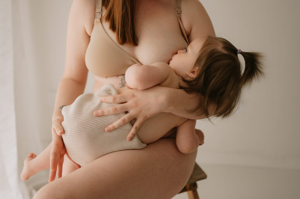 breastfeeding baby girl in york photography studio in yorkshire