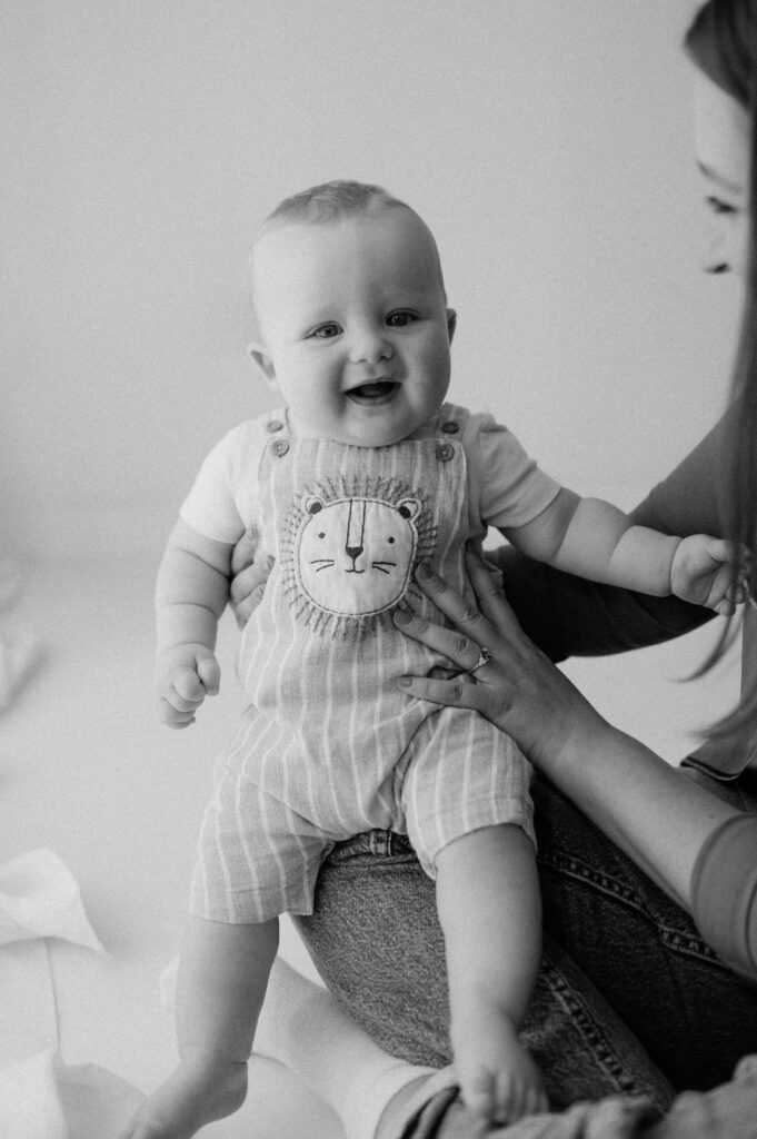 baby boy sat on mums lap