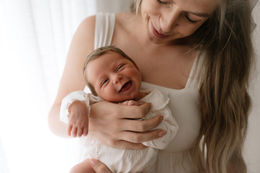 newborn photography baby girl smiling at York studio 