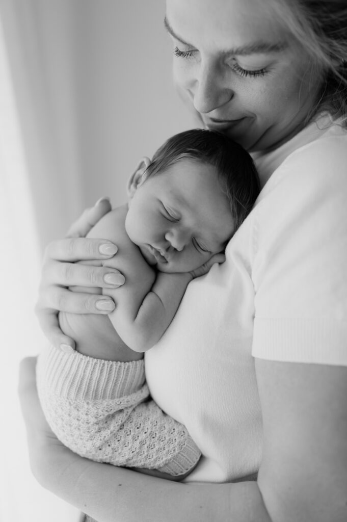 newborn baby girl on her mum